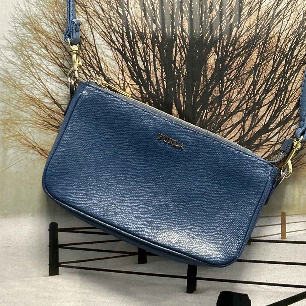 Furla gold hardware in a blue tone color no bag no damage in good condition